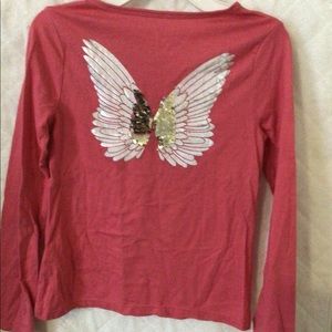 Pink long sleeved shirt.